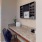 a built-in desk area with a chair