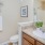 a bathroom with a sink toilet and a mirror