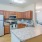 a kitchen with wooden cabinets