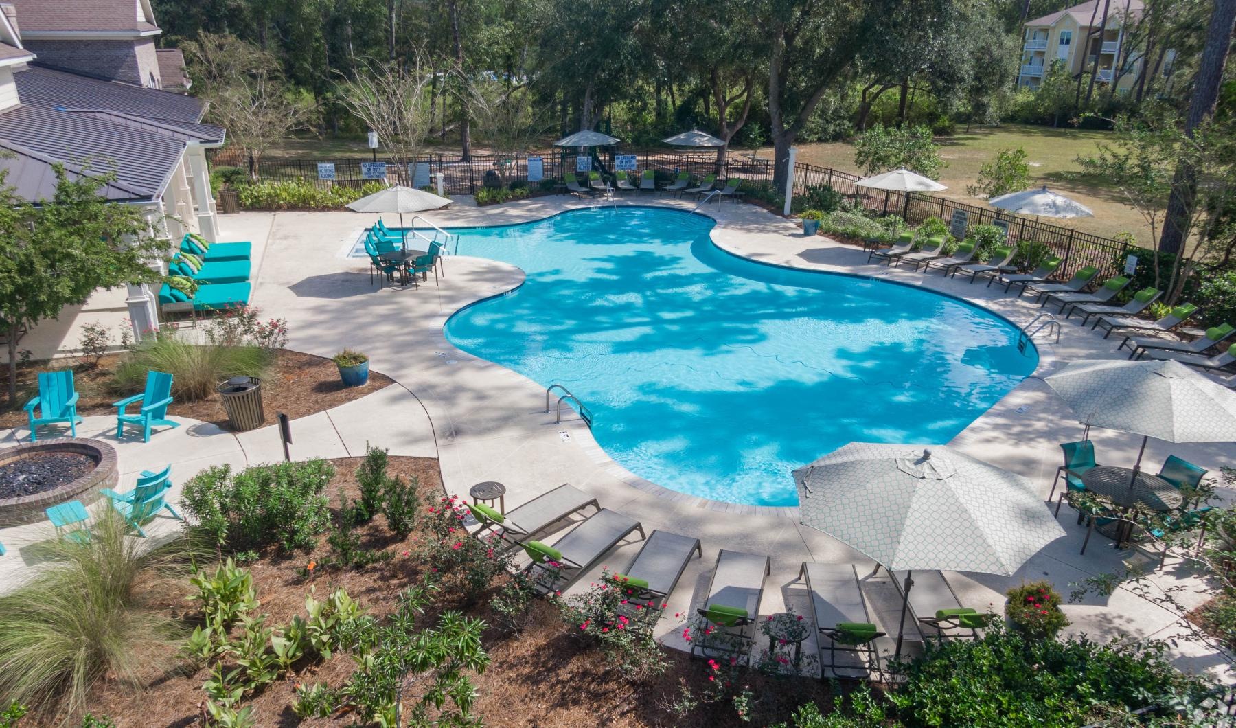 a pool with chairs around it