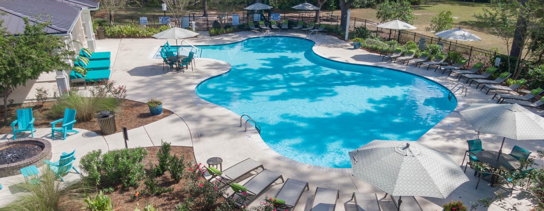 a pool with chairs around it