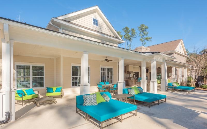 pool and lounge chair area outside of a building