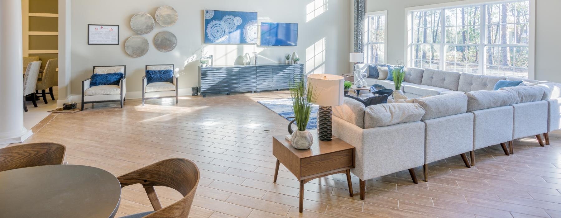 a living room with a large chandelier and a couch